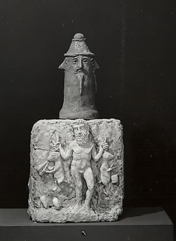 Romano-Barbarusian altar from a private shrine found at Cervellati, ca 270 AD. Bronze top shows face of Moon God, stone pedestal represents Hercules carrying two hares