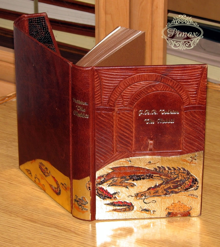 The Hobbit published by HarperCollins Publishers in 2007 received a very unique decoration: a bas-relief onlay enhanced with hand made tooling of Smaug the dragon