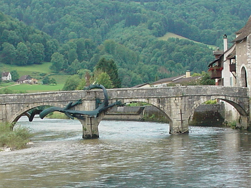 A dragon climbs on the bridge of Saint-Ursanne