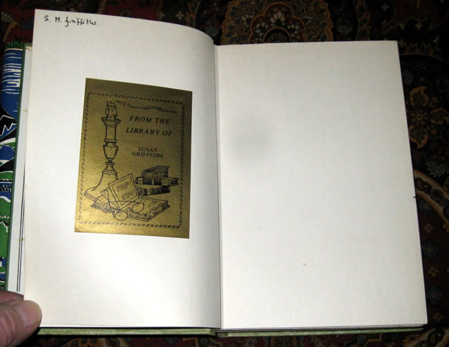 There is also a previous owner's name and bookplate (same) to the first blank page.