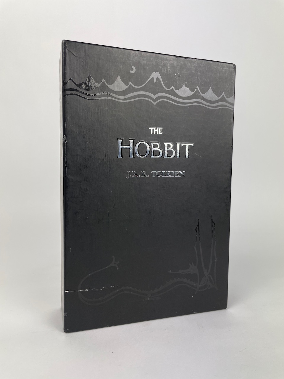 The Boxed set contains a copy of the Hobbit, as well as 8 postcards depicting the maps, color illustrations and the dustjacket from the book