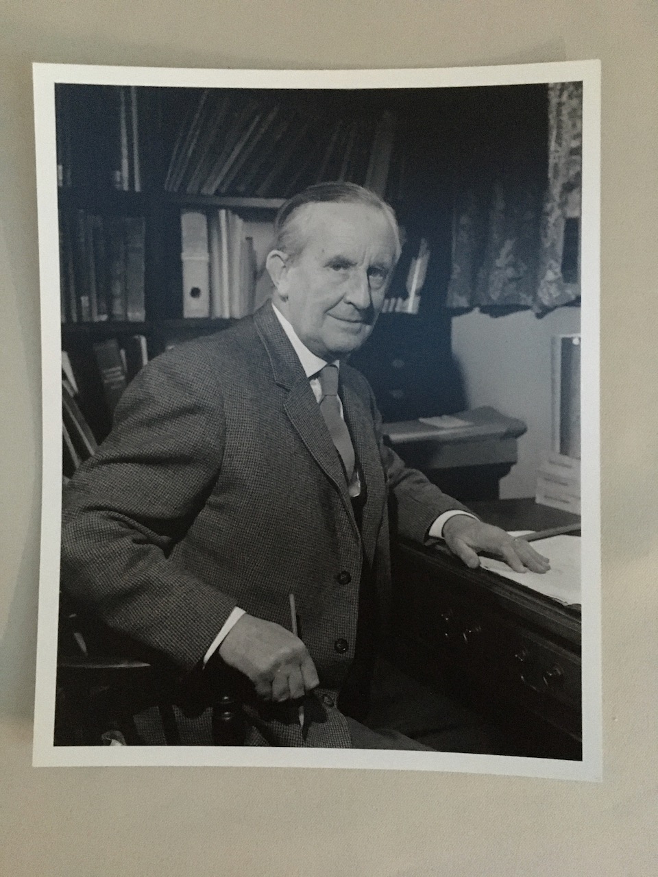 Exclusive Photographic Print: J.R.R. Tolkien sits at his writing desk, clutching a pen