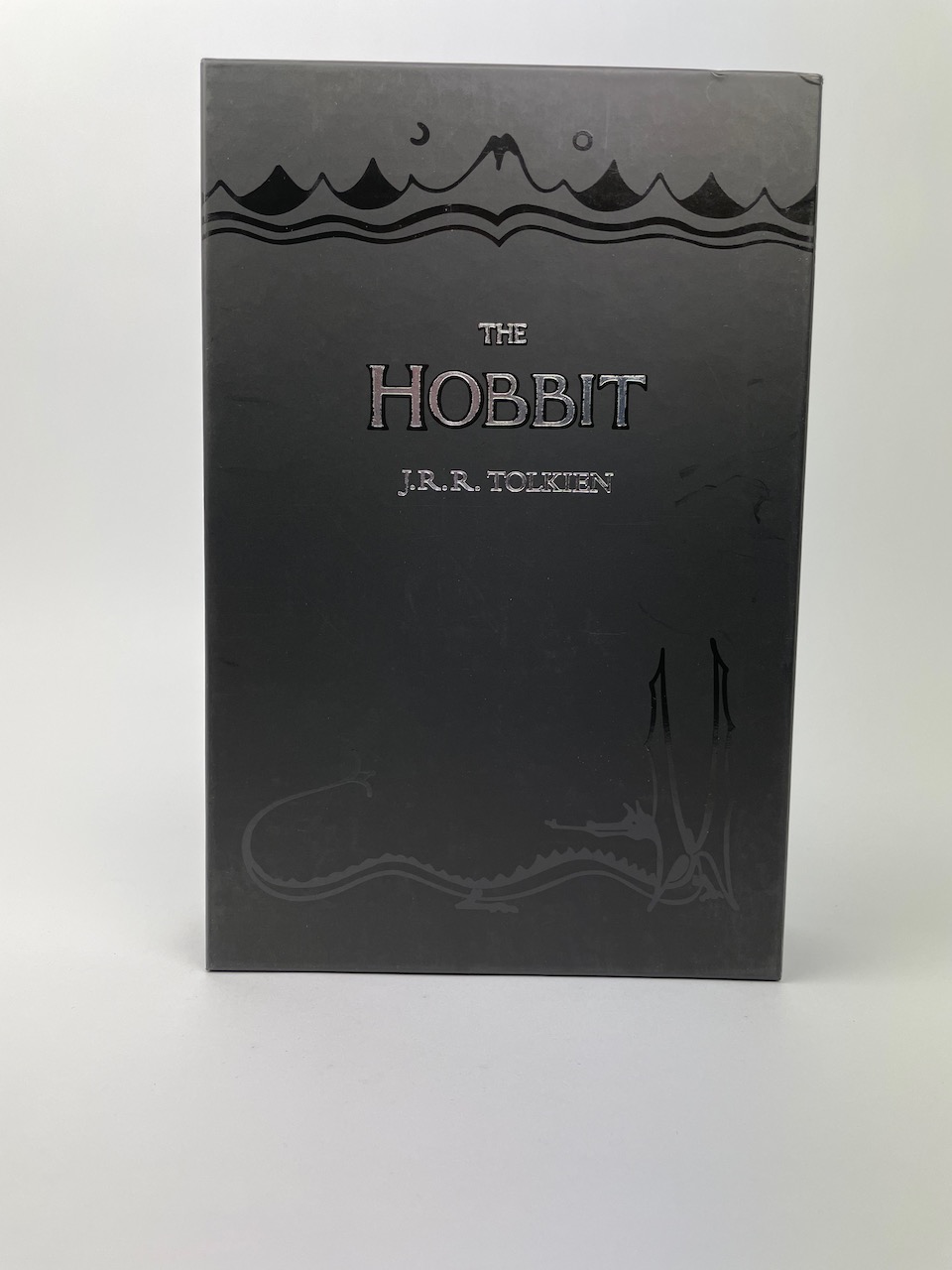 The Boxed set contains a copy of the Hobbit, as well as 8 postcards depicting the maps, color illustrations and the dustjacket from the book